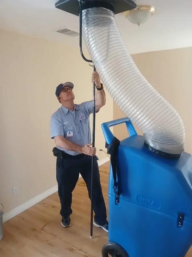 Furnace Tune-Up technician using HEPA equipment in Chesapeake Beach